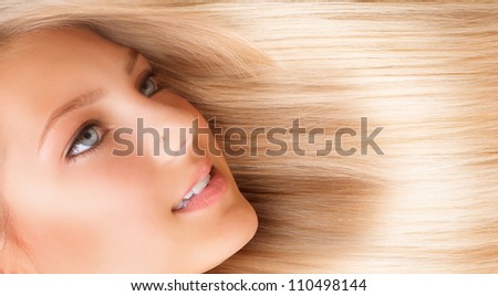 Hair. Beautiful Girl with Blond Long Hair. Blonde