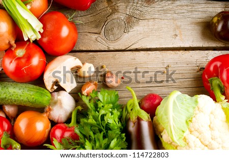 Vegetables on a Wooden Background. Art Border Design