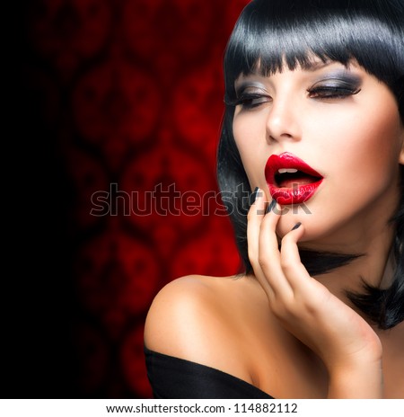 Beautiful Brunette Girl Portrait.Makeup. Sensual Red Lips and Smokey Eyes Make-up