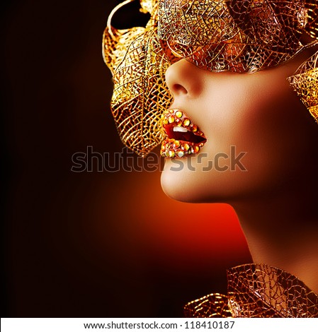 Luxury Golden Makeup. Beautiful Professional Holiday Make-up. Sexy Gold Lips.Fashion Art Portrait.Jewelry