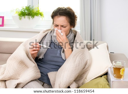 Sick Woman with Thermometer.Flu.Woman Caught Cold. Sneezing into Tissue. Headache.Virus.Flue