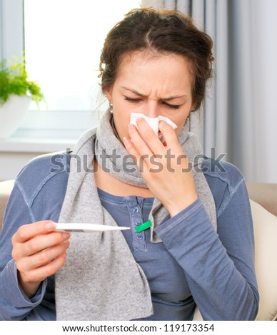 Sick Woman with Thermometer.Flu.Woman Caught Cold. Sneezing into Tissue. Headache. Virus