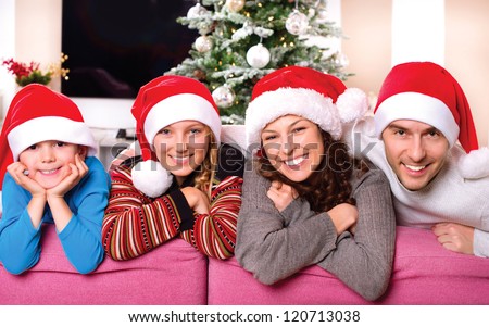 Christmas Family With Kids. Happy Smiling Parents And Children At Home