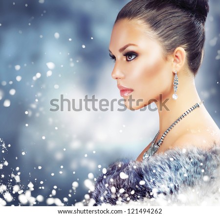 Winter Woman In Luxury Fur Coat.Beauty Christmas Girl Portrait. Fur Fashion. Snow. Jewelry
