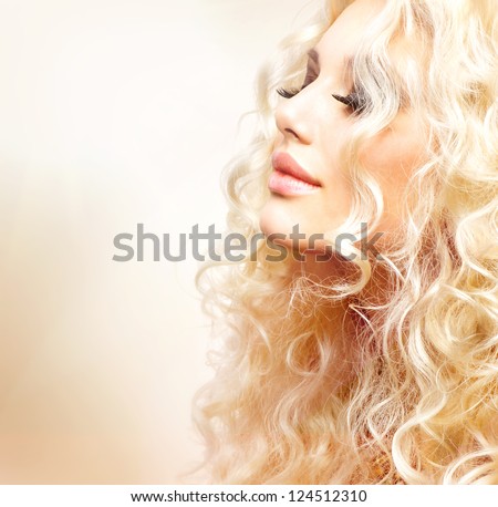 Beauty Girl With Healthy Long Curly Hair. Blonde Woman Portrait. Blond Wavy Hair
