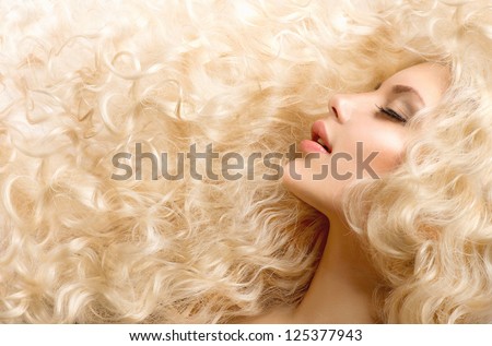 Curly Hair. Fashion Girl With Healthy Long Wavy Hair. Beauty Blonde Woman Portrait. Blond Hair, Hair Extension, Permed Hair
