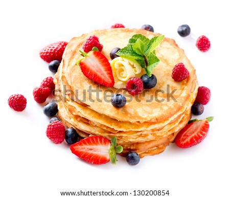 Pancakes. Crepes With Berries. Pancake stack with Strawberry, Raspberry, Blueberry  isolated on a White Background