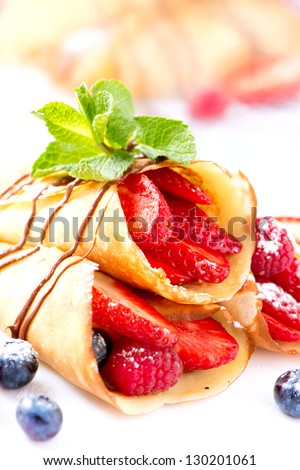 Crepes With Berries. Crepe with Strawberry, Raspberry, Blueberry and Chocolate topping
