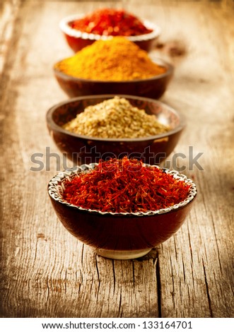 Spices Curry, Saffron, turmeric. Spice over Wood