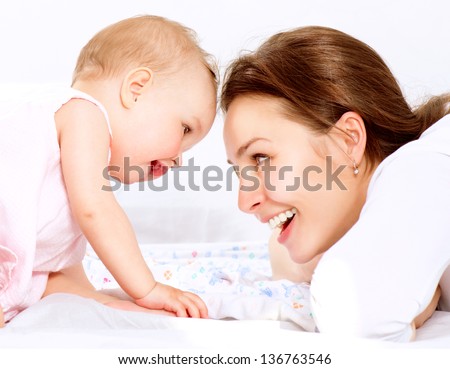 Mother and Baby playing and Laughing. Mom With her Child. Happy Family