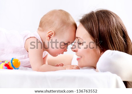 Mother And Baby Playing. Happy Family. Mom With Her Child.