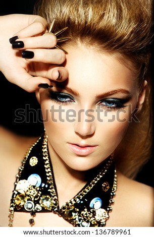 Fashion Rocker Style Model Girl Portrait. Hairstyle. Rocker or Punk Woman Makeup and Hairdo