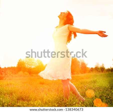 Enjoyment. Free Happy Woman Enjoying Nature. Beauty Girl Outdoor. Freedom concept. Beauty Girl over Sun
