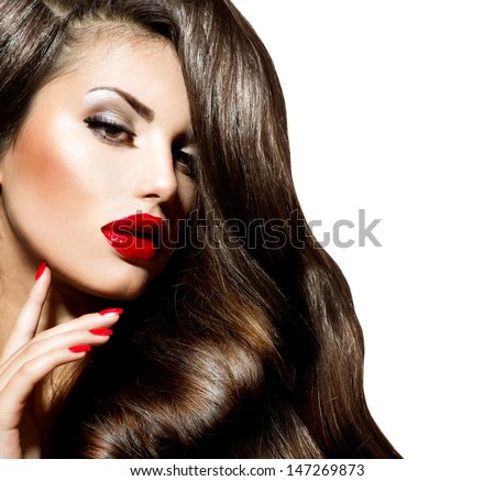 Sexy Beauty Girl With Red Lips And Nails. Make Up. Luxury Woman With Long Curly Hair. Fashion Brunette Portrait Isolated On A White Background. Gorgeous Woman Face.