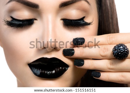 Beauty Fashion Model Girl with Black Make up, Long Lushes. Fashion Trendy Caviar Black Manicure. Nail Art. Dark Lipstick and Nail Polish