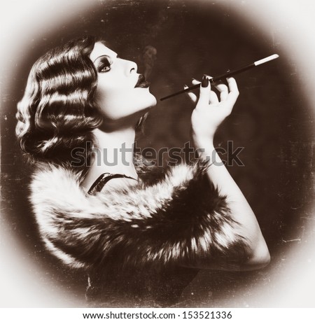 Retro Woman Portrait. Beautiful Woman with Mouthpiece. Cigarette. Smoking Lady. Vintage Styled Black and White Photo. Old Fashioned Makeup and Finger Wave Hairstyle. 20\'s or 30\'s style. Sepia toned