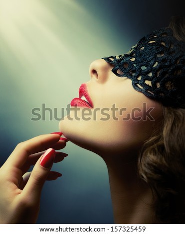 Beautiful Woman With Black Lace Mask Over Her Eyes. Red Sexy Lips And Nails Closeup. Open Mouth. Manicure And Makeup. Make Up Concept. Passion