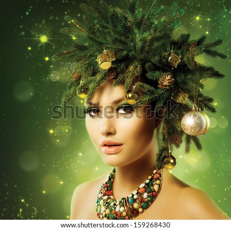 Christmas Woman. Beautiful New Year and Christmas Tree Holiday Hairstyle and Make up. Beauty Fashion Model Girl Portrait