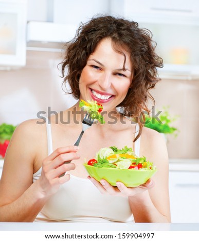 Diet. Beautiful Young Woman Eating Vegetable Salad. Dieting concept. Healthy Food