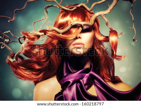 Red Hair. Fashion Model Woman Portrait With Long Curly Red Hair On Wood Branches. Autumn. Hair Extension
