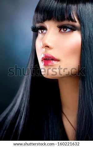 Beautiful Brunette Girl. Healthy Long Black Hair. Long Eyelashes. Fringe Hairstyle. Beauty Woman Portrait. Make Up