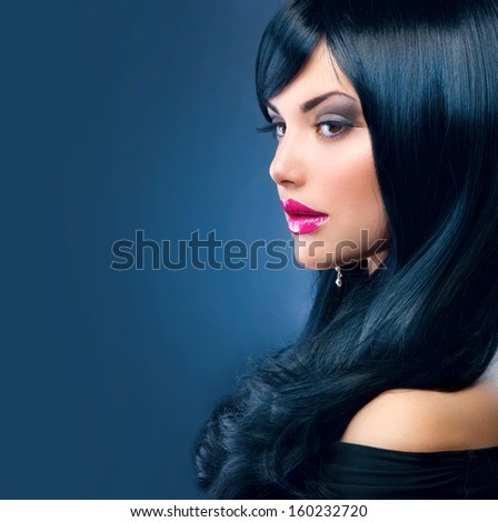 Beautiful Brunette Woman. Healthy Long Black Hair. Long Eyelashes. Fringe Hairstyle. Beauty Girl Portrait. Make Up. Curly Black Hair