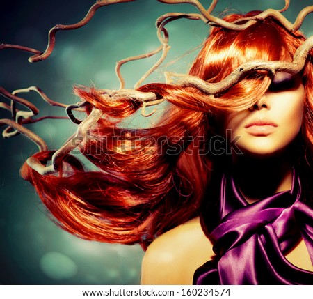 Red Hair. Fashion Model Woman Portrait with Long Curly Red Hair on Wood Branches. Autumn. Hair Extension