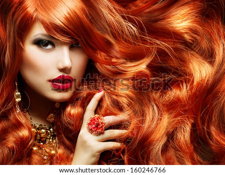 Long Curly Red Hair. Fashion Woman Portrait. Beauty Model Girl With Luxurious Hair, Make Up And Accessories. Hairstyle. Wavy Hair Extensions Concept. Holiday Makeup. Smoky Eyes And Red Lipstick
