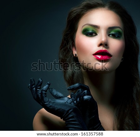 Beauty Fashion Glamour Girl Portrait. Vintage Style Model Girl Wearing Gloves. Holiday Glamour Make-Up. Red Lipstick And Deep Green Eyeshadows. Darkness. Beautiful Mysterious Woman Dark Portrait