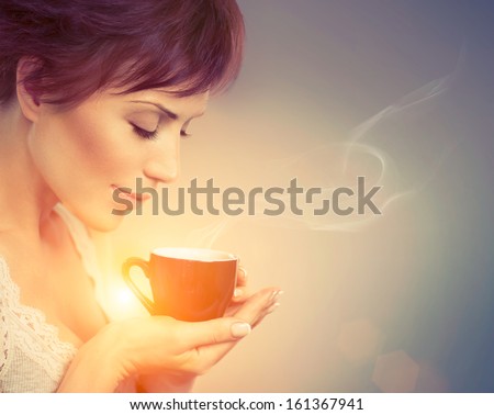 Beautiful Girl Drinking Tea Or Coffee. Beauty Woman With Cup Of Hot Beverage. Enjoying Coffee. Warm Pastel Colors