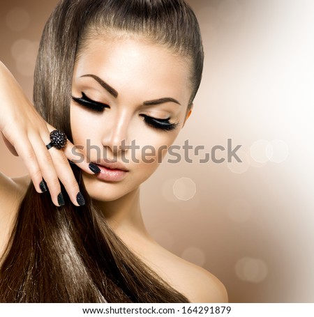 Beauty Fashion Model Girl With Long Healthy Brown Hair, Long Eyelashes. Fashion Trendy Caviar Black Manicure. Nail Art. Beautiful Stylish Woman With Healthy Smooth Skin. Ponytail. Perfect Makeup