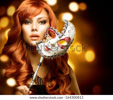 Beautiful Woman With The Carnival Mask. Holiday Fashion Girl Portrait. Beauty Hairstyle And Makeup. Make Up. Celebrating Glamorous Lady