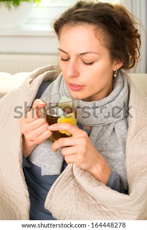 Sick Woman with Hot Drink. Headache. Flu. Woman Caught Cold. Virus