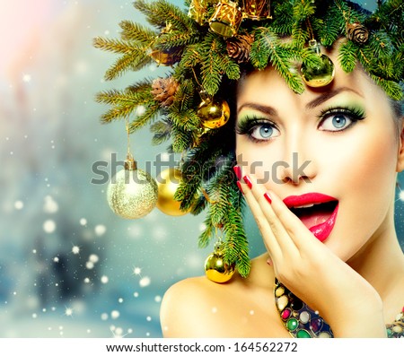 Christmas Woman. Beautiful New Year And Christmas Tree Holiday Hairstyle And Make Up. Beauty Girl Portrait Over Winter Background. Colorful Makeup And Hair. Surprised Woman. Open Mouth, Emotions