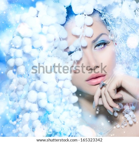 Winter Beauty. Beautiful Beautiful Fashion Model Girl With Snow Hair Style And Make Up. Holiday Makeup And Manicure. Winter Queen