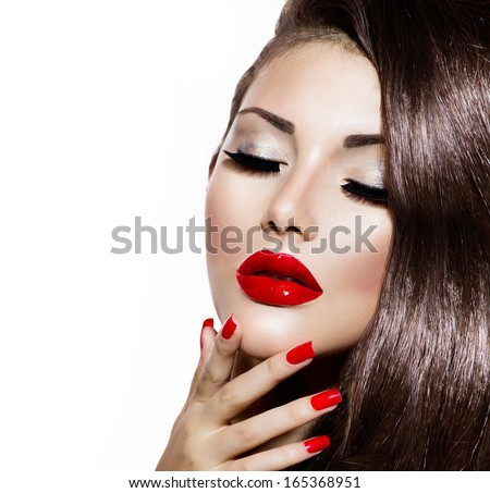 Sexy Beauty Girl with Red Lips and Nails. Provocative Make up. Luxury Woman with Blue Eyes. Fashion Brunette Portrait isolated on a white background. Gorgeous Woman Face. Long Hair