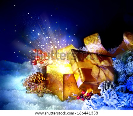 Christmas Gift Box with miracle. Magic Stars and Light. Winter Holiday Art Background with Snow and Gifts. Present Box. New Year Open gift box and magic light fireworks