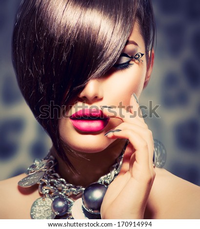 Hairstyle. Fringe. Haircut. Beauty Sexy Model Girl Portrait with Perfect Makeup and Manicure. Healthy Smooth Skin. Make up. Diamond Collar Accessories. False Eyelashes
