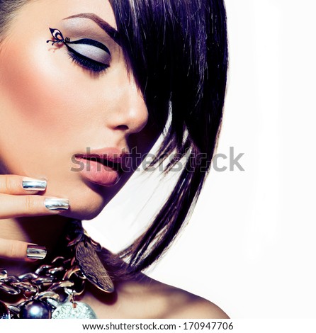 Fashion Model Girl Portrait. Trendy Hair Style. Short Haircut. Hairstyle. Beauty Woman Closeup. Fringe. Hairdressing. Silver Metallic Accessories And Manicure. Beauty Woman Close Up. Perfect Skin