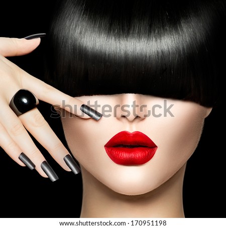 High Fashion Model Girl Portrait with Trendy Hair style, Make up and Manicure. Long Black Fringe Hairstyle, Black Matte Nail Polish and Red Matte Lipstick. Woman Makeup. Sexy Lips. Haircut