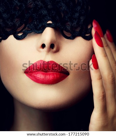 Beautiful Woman With Black Lace Mask Over Her Eyes. Red Sexy Lips And Nails Closeup. Sensual Mouth. Manicure And Makeup. Make Up Concept. Passion