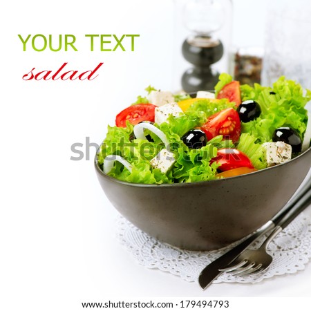 Salad. Greek Salad isolated on a White Background. Mediterranean Salad with Feta Cheese, Tomatoes and Olives. Healthy fresh vegetarian food