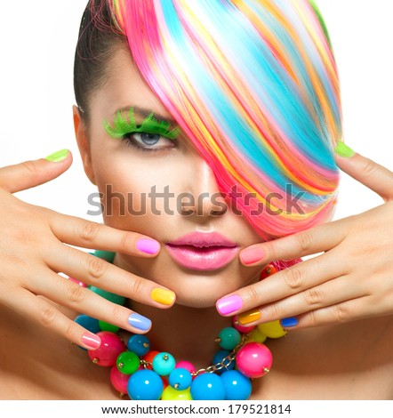 Beauty Girl Portrait with Colorful Makeup, Hair, Nail polish and Accessories. Colourful Studio Shot of Stylish Woman. Vivid Colors. Manicure and Hairstyle. Rainbow Colors