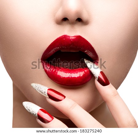 Fashion Model Girl Face. Makeup and Manicure. Red Long Nails and Red Glossy Lips. Sensual Mouth. Nail Art. Beautiful Sexy Lips. Fashion. Professional Make-up. Perfect Skin
