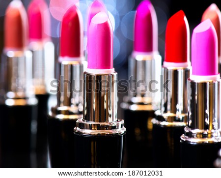 Lipstick. Makeup concept. Fashion Colorful Lipsticks. Professional Makeup and Beauty. Beautiful Make-up. Lipgloss. Lipsticks closeup over blinking bokeh background