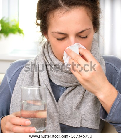 Sneezing woman into tissue. Sick Woman. Flu. Woman Caught Cold. Allergy. Headache. Virus. Medicines