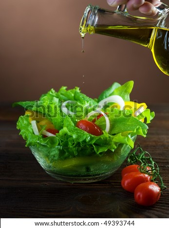 Healthy Salad and Pouring olive oil