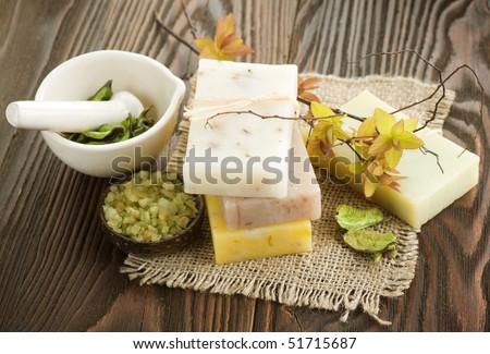 Handmade Soap with natural ingredients over wooden background