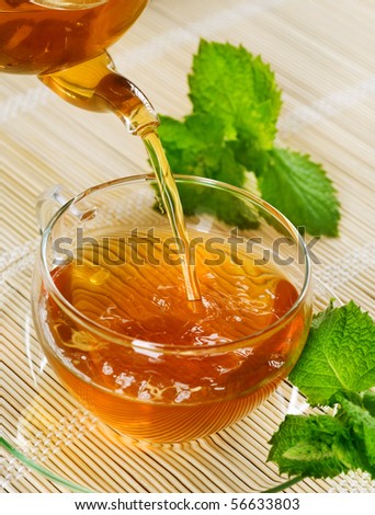 Pouring Healthy Tea with Mint