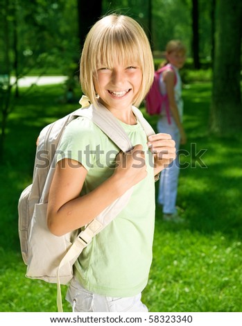 Happy Schoolgirl Outdoor.Back to School concept.